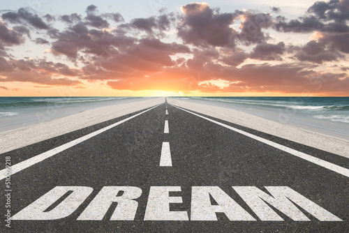 Fotografija Dream sign on a highway at  the beach with the sunset in the background