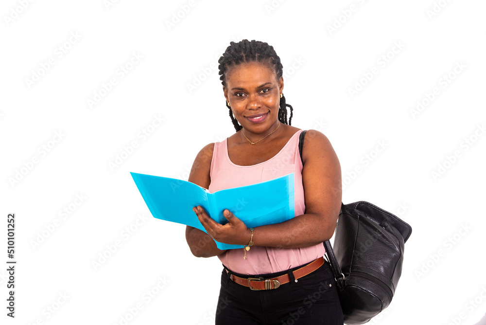 young student writing in document on clipboard. young student writing in document on clipboard.