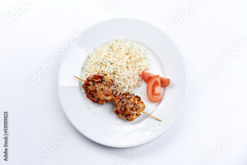 pork kebab with rice on the white plate