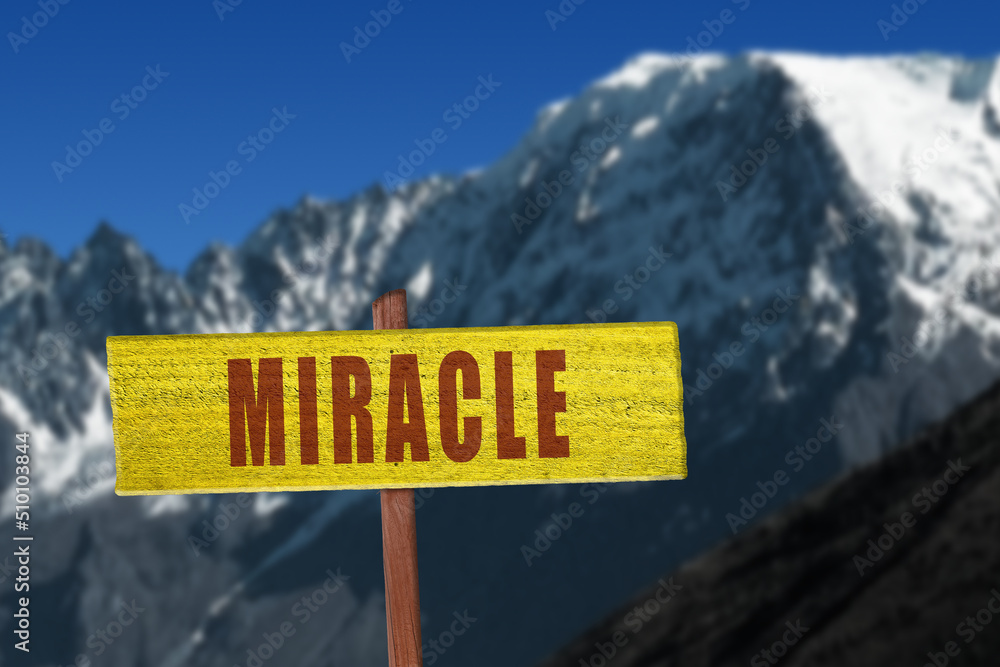 Miracle sign with snowy mountains in the background.