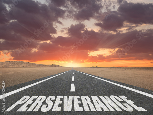 Inspirational Perseverance sign on road for success concept. photo