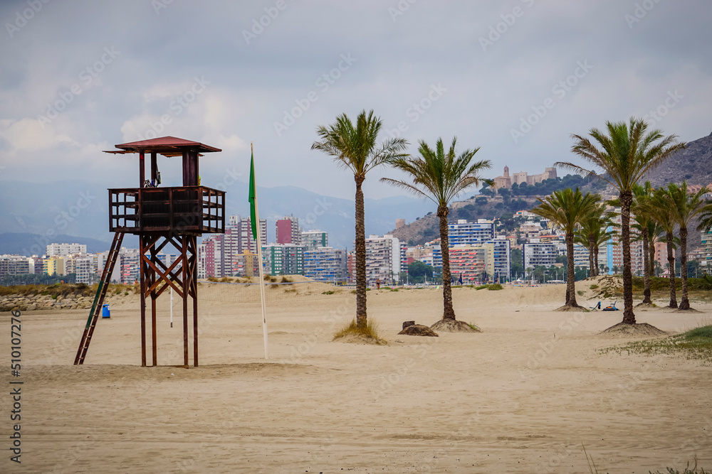 Panoramic view of the castle of the city of Cullera with the beach and the lifeguard tower in the foreground Panoramic view of the castle of the city of Cullera with the beach and the lifeguard tower in the foreground