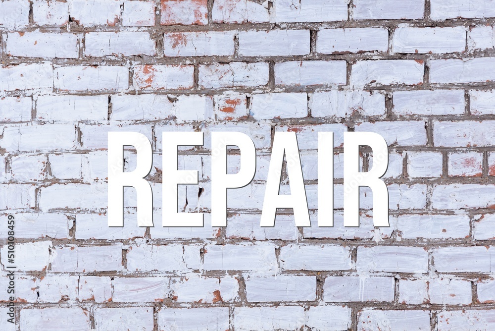 REPAIR - word on concrete background. Cement floor, wall. REPAIR - word on concrete background. Cement floor, wall.