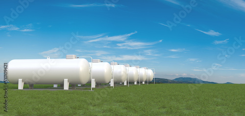 Fotografie Row of big gas tanks in summer landscape