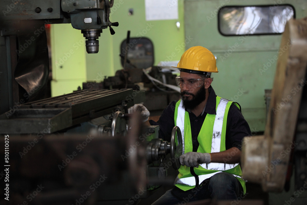 Industrial Engineers with machine.production engineer in industry. He checking or push metalwork control in industrial factory for Concept Successful of Work. Industrial Engineers with machine.production engineer in industry. He checking or push metalwork control in industrial factory for Concept Successful of Work.