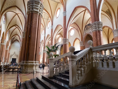 Interior of Basilica di San Petronio in Bologna with staircase and gothic archs photo