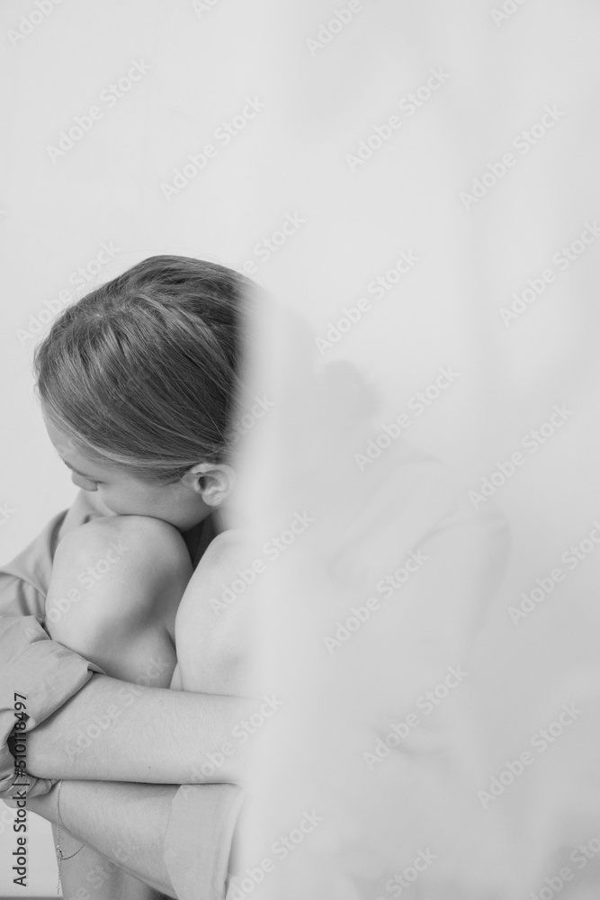 black and white art portrait of a girl resting her head on her knees ...