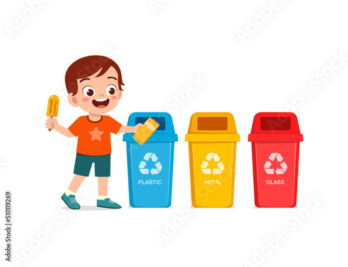 little kid throw plastic waste to recycle bin