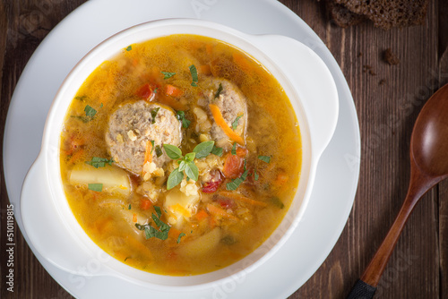 Soup with meatballs. Top view, a place to copy. Soup with meatballs and vegetables.