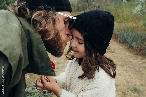 Dad gave his daughter a flower