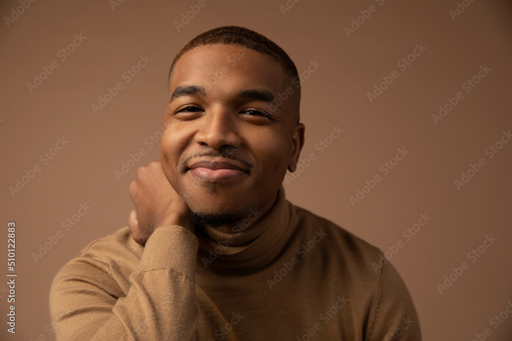 Happy Man in Front of Beige Backdrop Smiles Happy Man in Front of Beige Backdrop Smiles