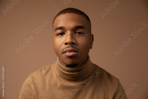 Young Man Looks at Camera Expressionless