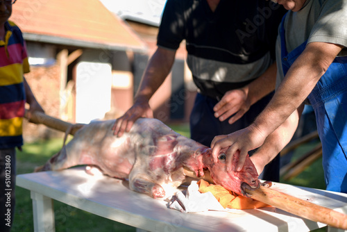 Old friends preparing the lamb for a traditional holiday