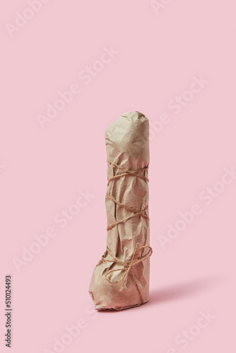 Vibrator dildo inside craft paper photo