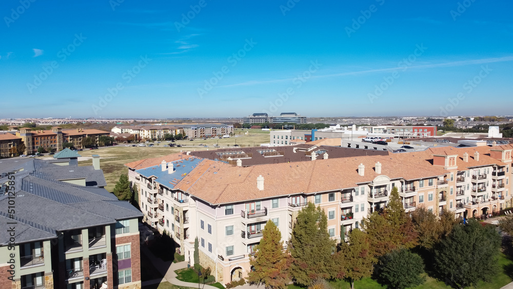 Top view brand new high-rise apartment complex with office buildings in background near Dallas, Texas, America