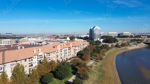 Top view brand new high-rise apartment complex with office buildings in background near Dallas, Texas, America photo