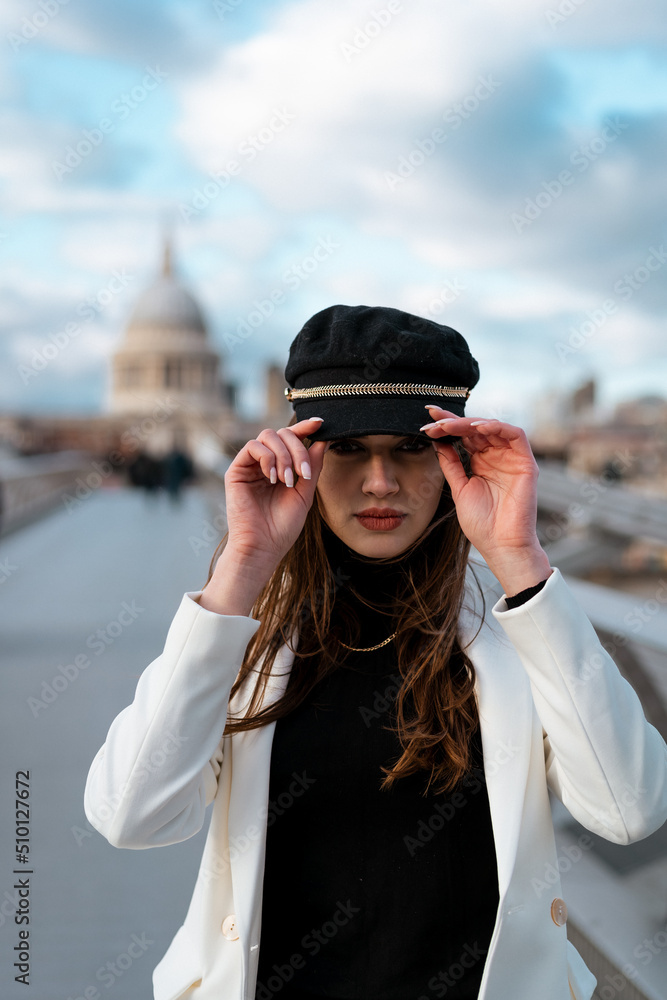 Elegant woman set up her cap Elegant woman set up her cap