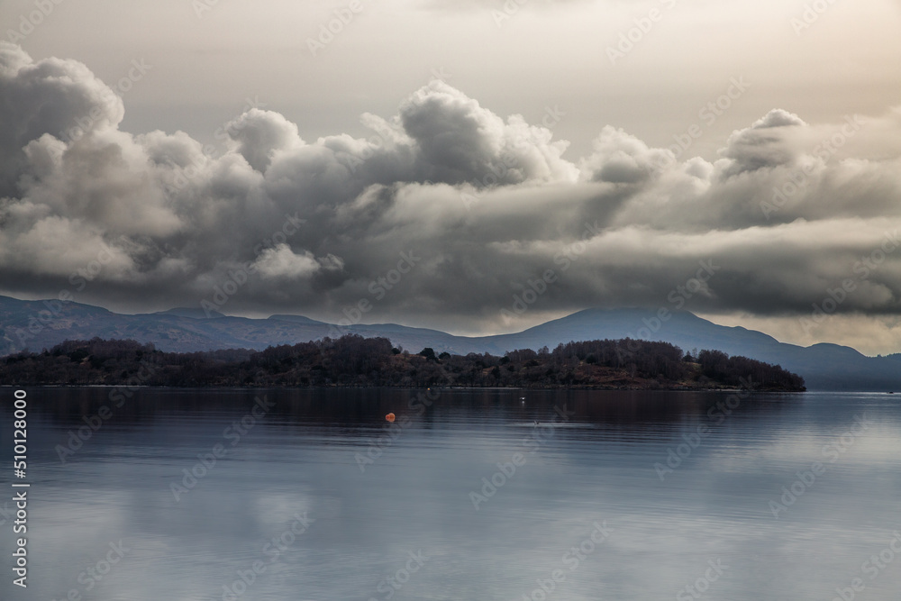 Loch Lomond is a lake in southern Scotland. It’s part of the Loch Lomond and The Trossachs National Park.  Shot in winter.

