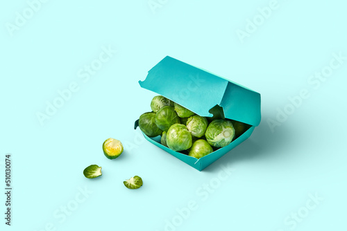 Fresh brussel sprouts lying inside burger box