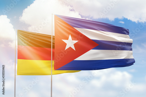 Photography Sunny blue sky and flags of cuba and germany