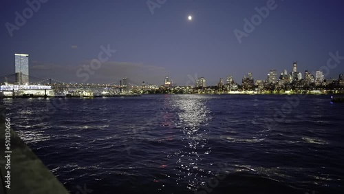 Manhattan, USA - 16. November 2021: East river and Brooklyn Bridge at twilight. Night in NYC view from Manhattan to Brooklyn