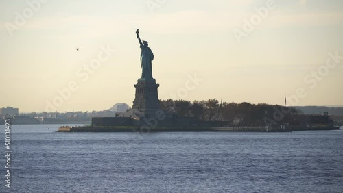 Statue of Liberty seen from Governors Island in Manhattan. Lady Liberty during sunset