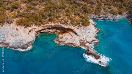 azure water surrounding a cave in turkey