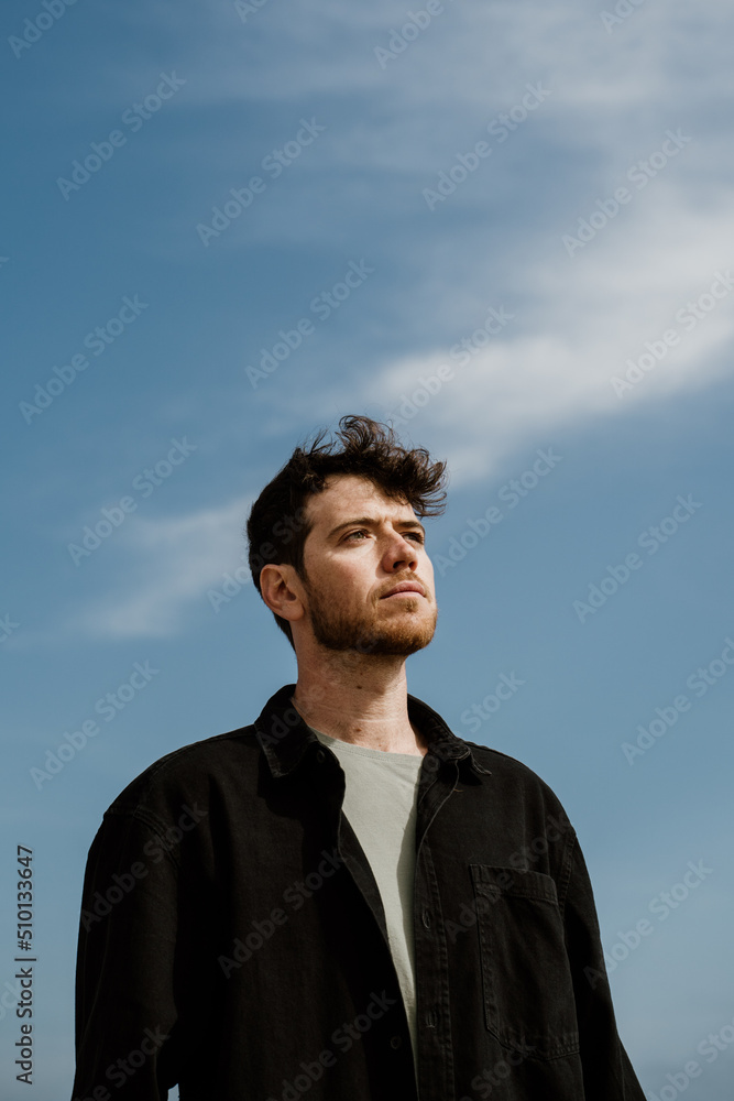 Fashion Portrait of handsome serene man outdoors in the city Fashion Portrait of handsome serene man outdoors in the city