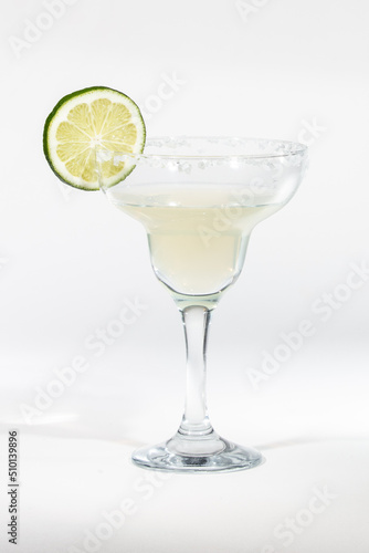 Isolated Margarita with a lime wedge over a white background 