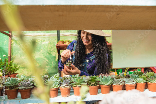 Happy smiling woman tending her plants