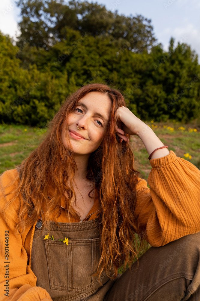 Portrait of happy confident woman in nature at sunset Portrait of happy confident woman in nature at sunset