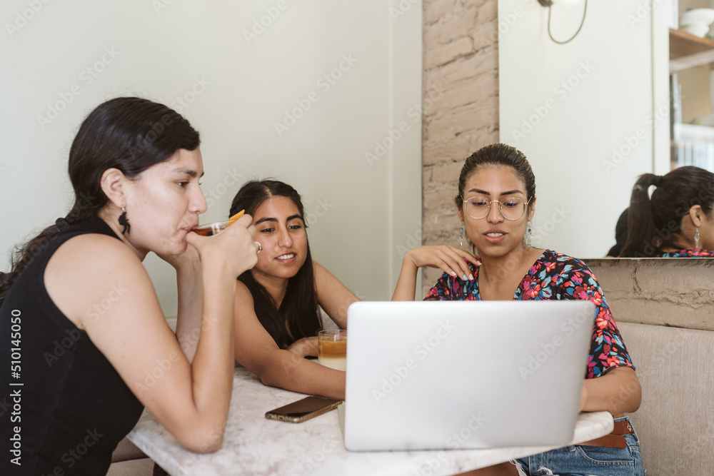 Female entrepreneurs working on a coffee shop Female entrepreneurs working on a coffee shop