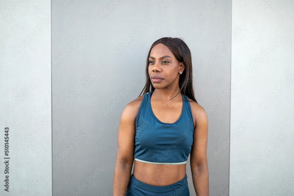 Portrait of black woman in sportswear outdoors Portrait of black woman in sportswear outdoors