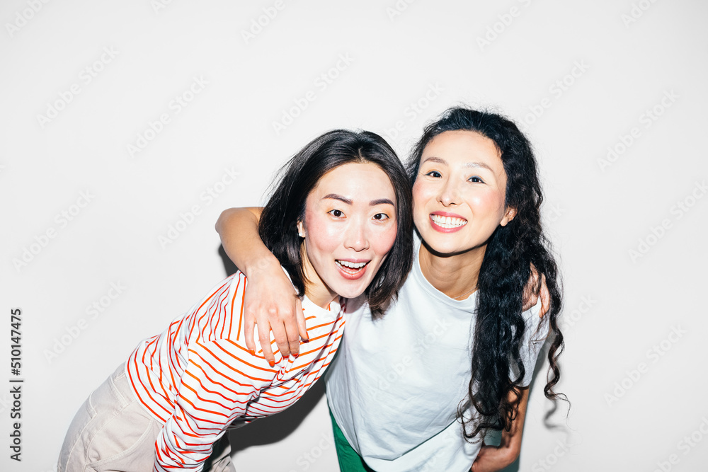 Two Asian Women Posing in Studio Two Asian Women Posing in Studio