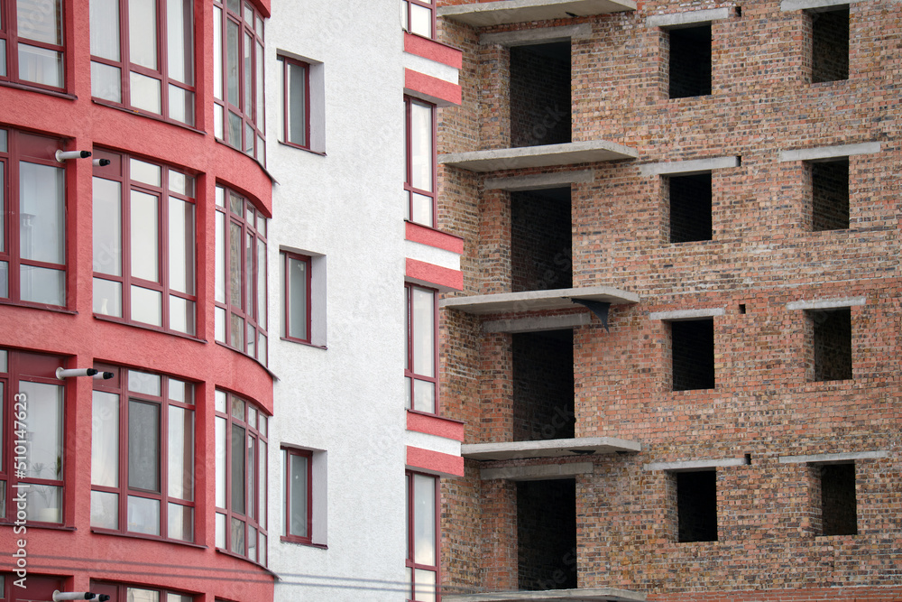 Fototapeta premium Architectural detail of high frame of monolithic concrete building under construction. Real estate development