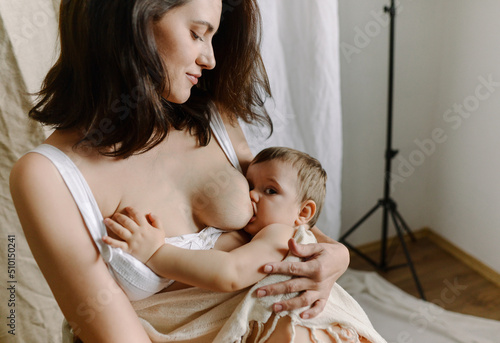 woman breastfeeding her son photo