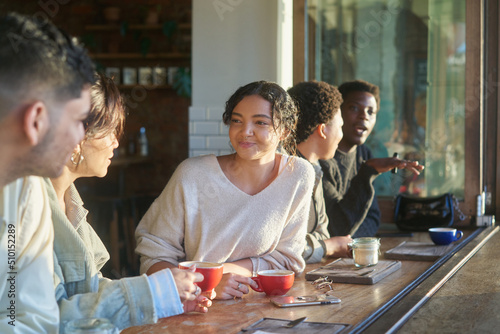 Young friends at local coffee shop photo