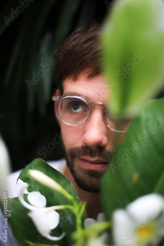 Portrait of a millennial in a garden photo
