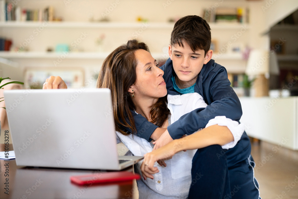 Son embracing working mom during break Son embracing working mom during break