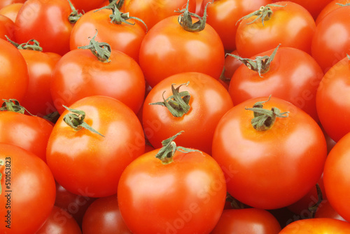 Many ripe tomatoes close up. Tomato background.