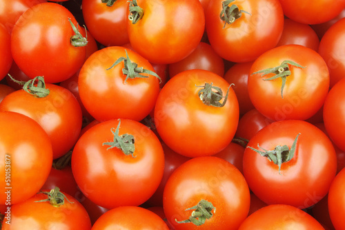 Many ripe tomatoes close up. Tomato background.