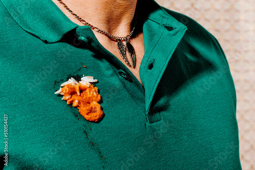 man with a stain of chicken tikka masala