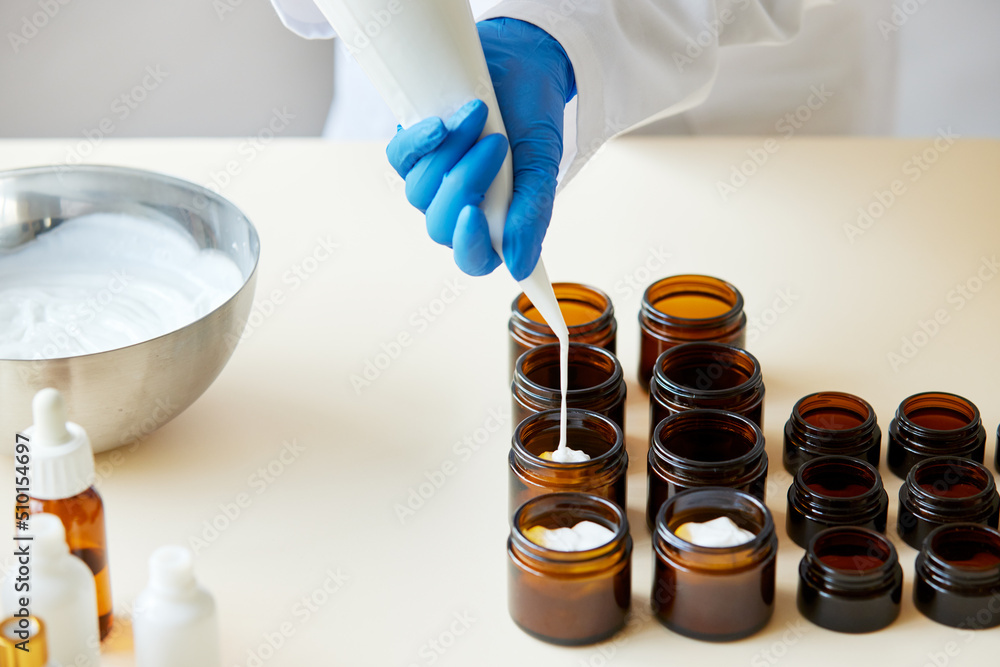 © ALTO IMAGES/Stocksy - Anonymous person pouring cream into jars © ALTO IMAGES/Stocksy - Anonymous person pouring cream into jars