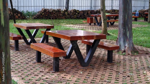 Schilderij op canvas Wooden patio chair reclaimed wood outdoor dining table on tropical rainforest