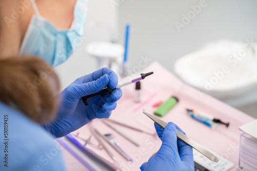 Anonymous Dentist Holding Tools photo