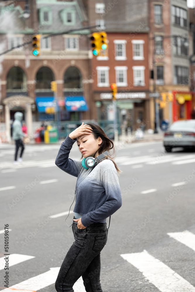 Woman with headphones in city Woman with headphones in city