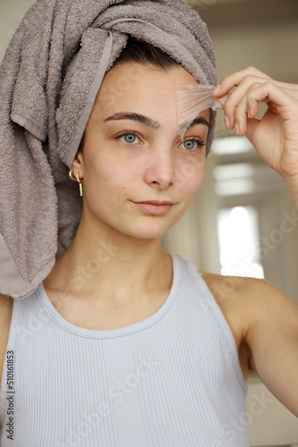 young woman with peel-off face mask photo