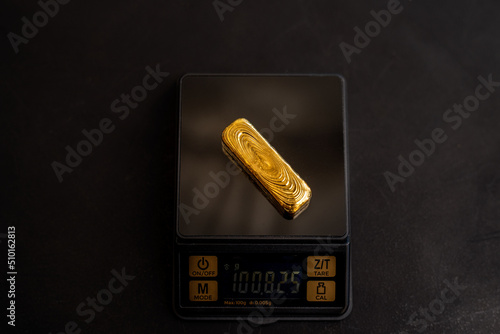 Gold Bullion on scales  photo