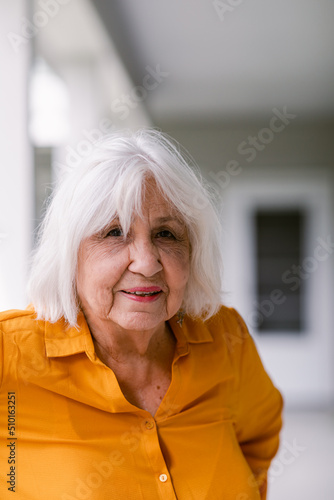 Content Senior woman at elderly housing apartment portrait photo