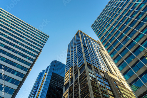Modern office glasses buildings cityscape under blue clear sky in Washington DC  USA  outdoors financial skyscraper concept  symmetric and perspective architecture